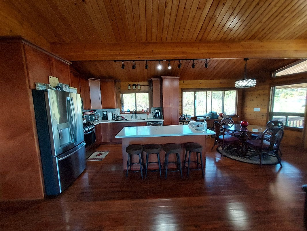 533 Hoaka Road Hilo, HI 96720 - Photo 11 of 30 a large room with lots of furniture and wooden floor