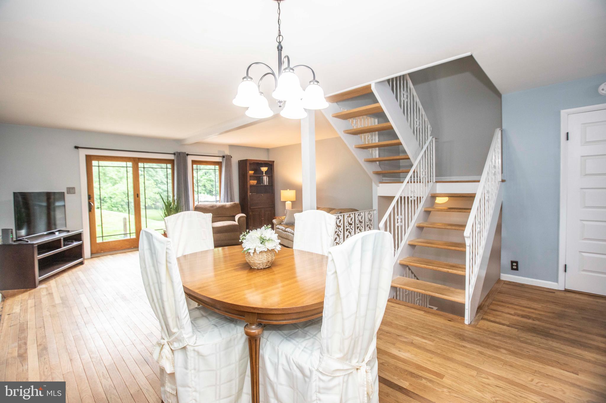 39 Tee Circle Reading, PA 19607 - Photo 11 of 33 Large stairway and dining space in living room.