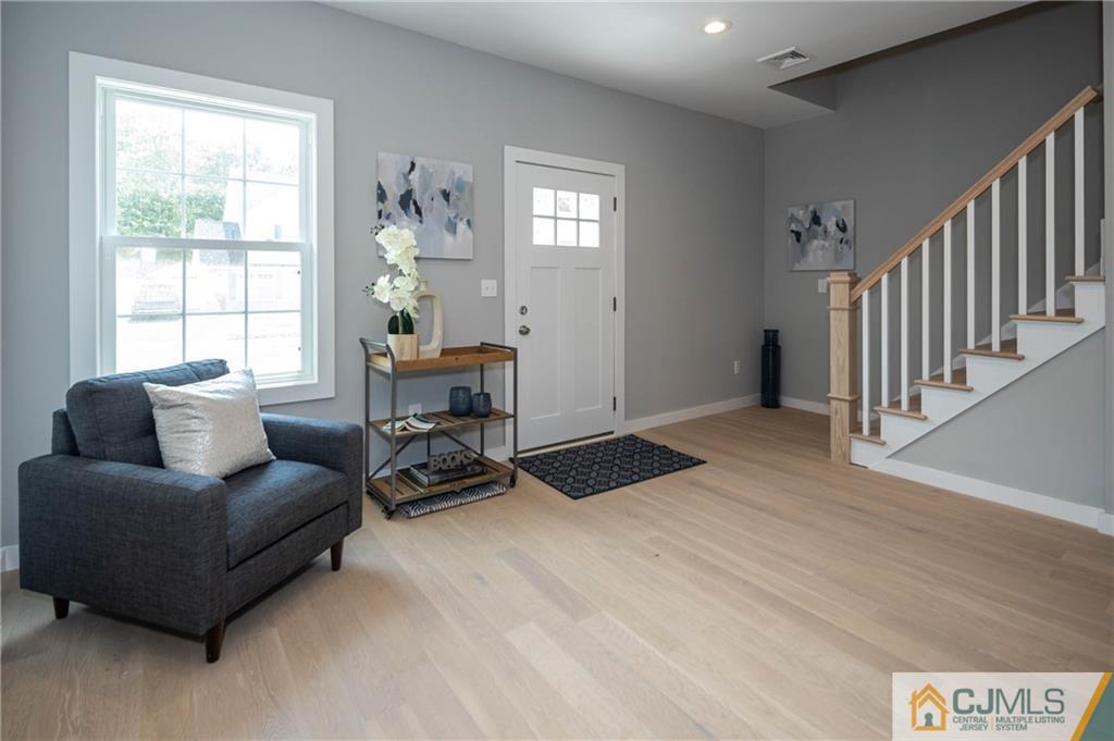 37 Markham Road Edison, NJ 08817 - Photo 14 of 30 a living room with furniture and a window