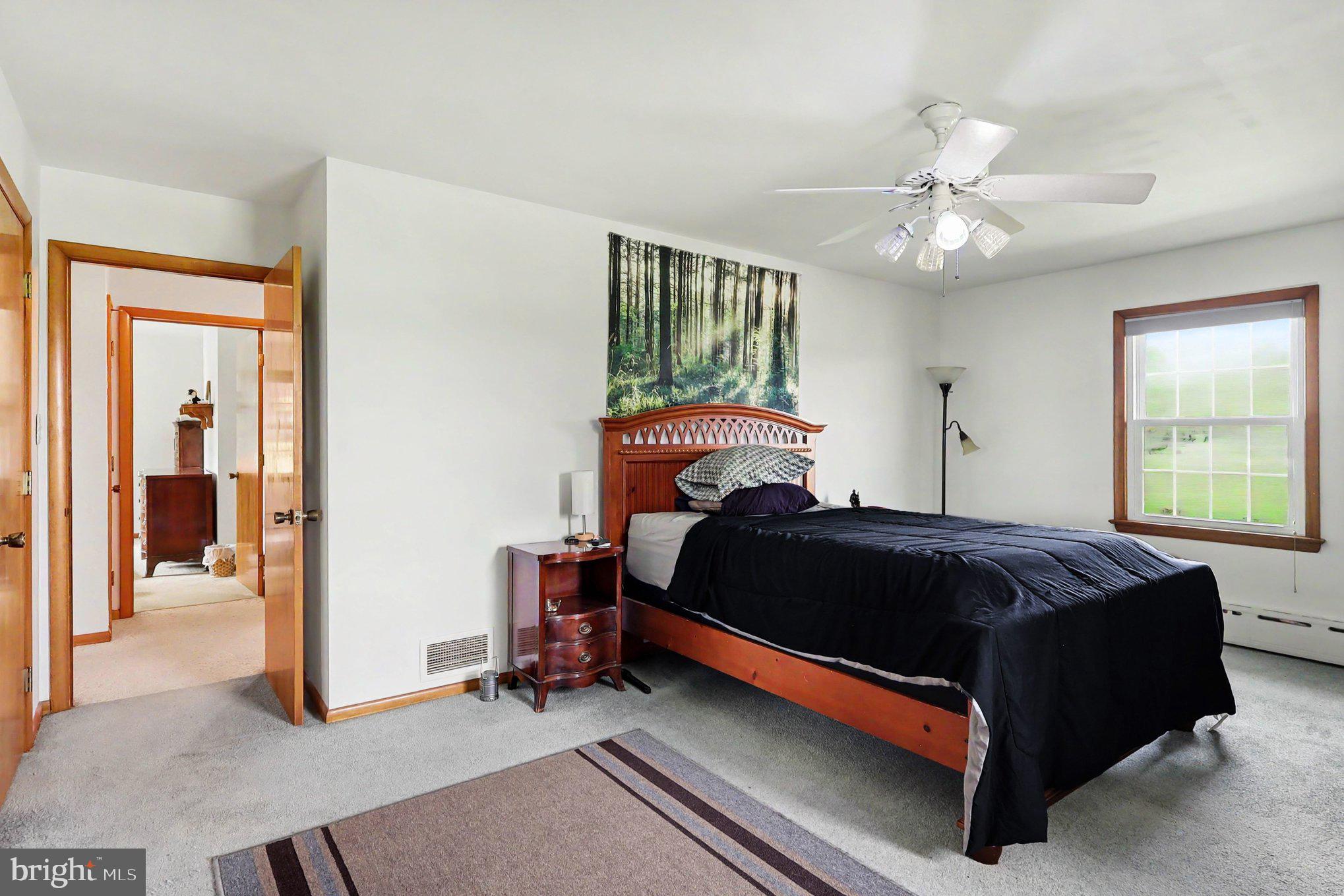 5 Eden Road Luray, VA 22835 - Photo 23 of 49 a bedroom with a bed and a chandelier