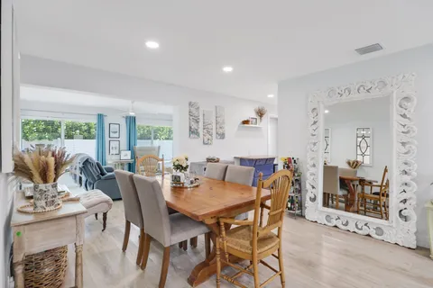 a view of a dining room with furniture window and outside view