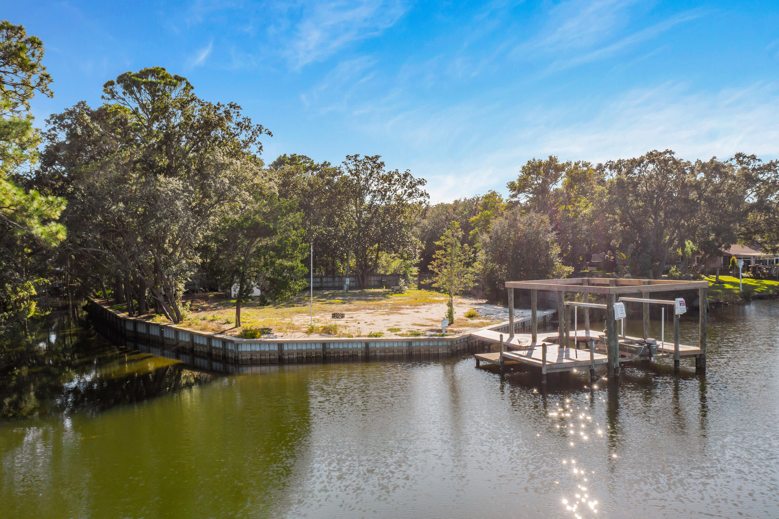 2420 Mack Bayou Road Santa Rosa Beach, FL 32459 - Photo 1 of 34 a view of a lake with houses