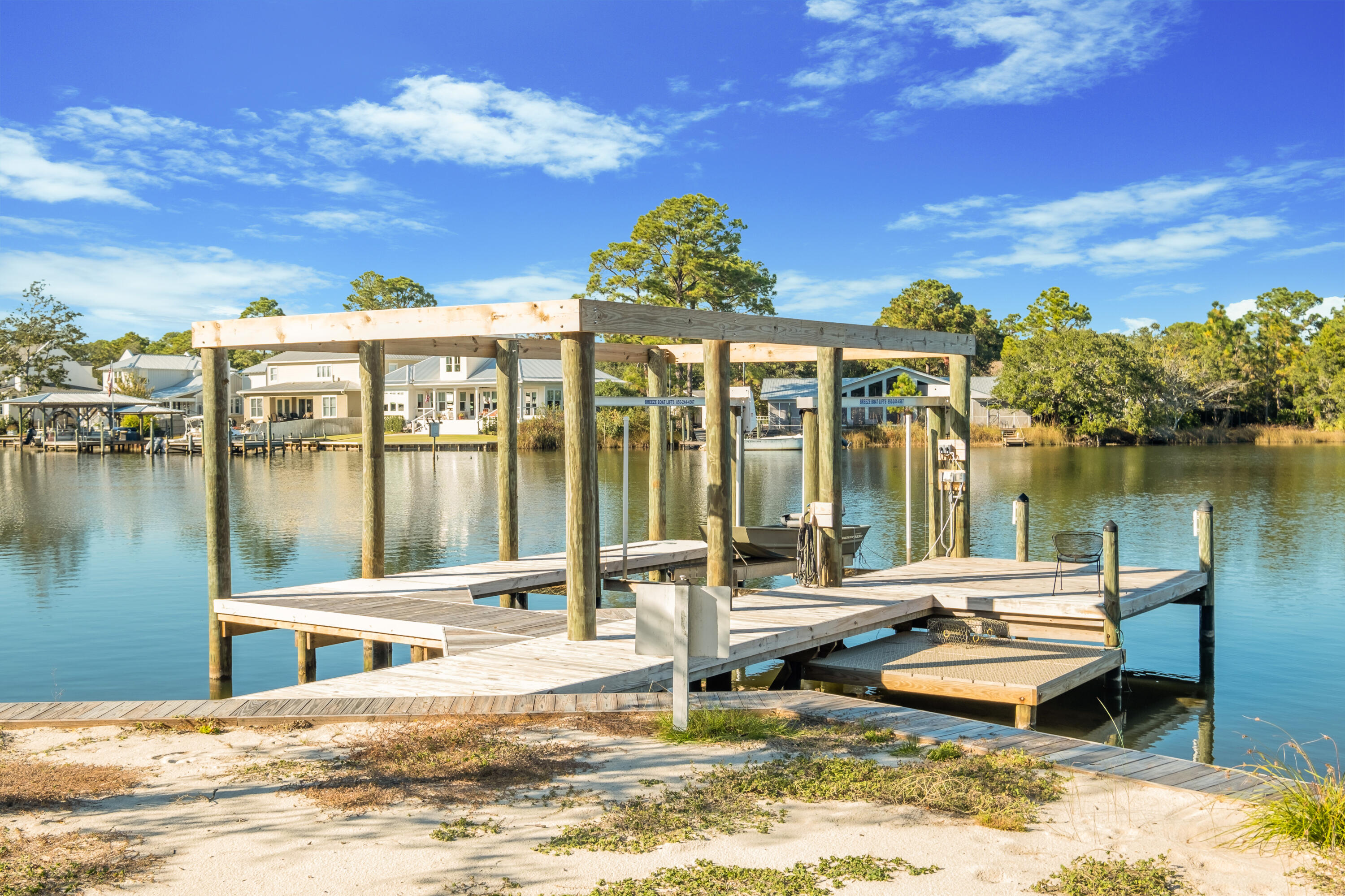 2420 Mack Bayou Road Santa Rosa Beach, FL 32459 - Photo 3 of 34 a view of a lake with couches and city view