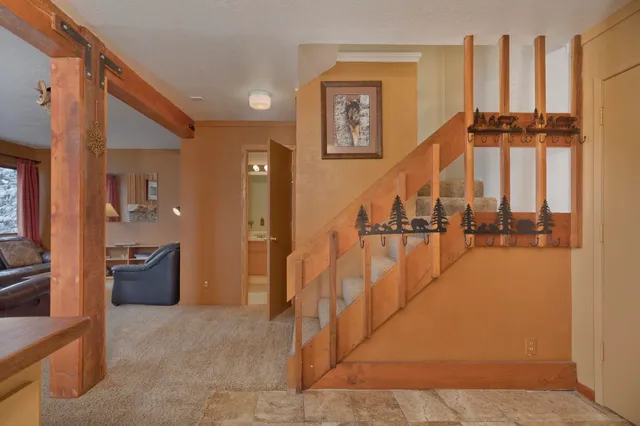 a view of entryway and hall with dining room