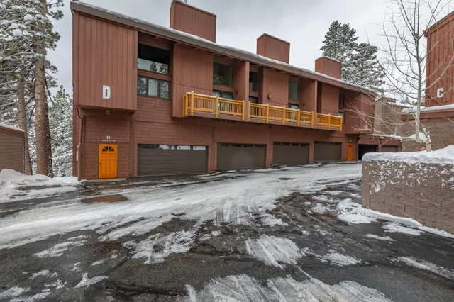 a front view of a house with a road