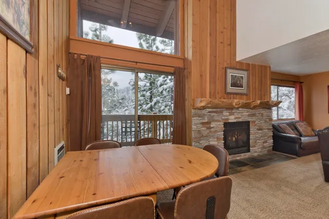 a bed sitting in a spacious bedroom next to a window
