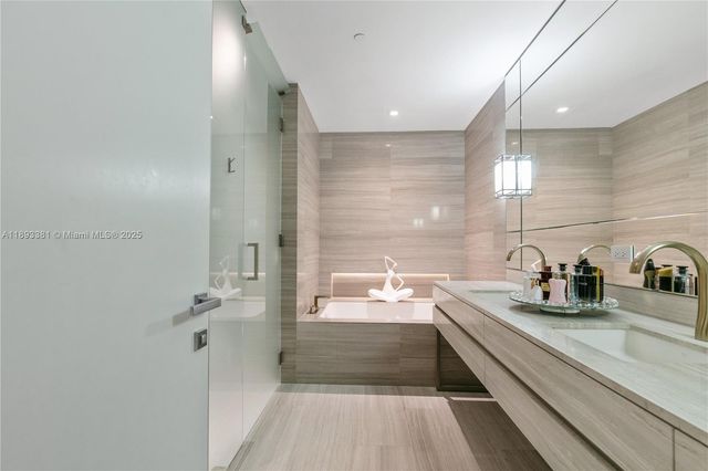 a view of a bathroom from a hallway