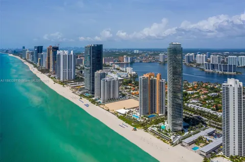 a view of a building with garden and sitting area