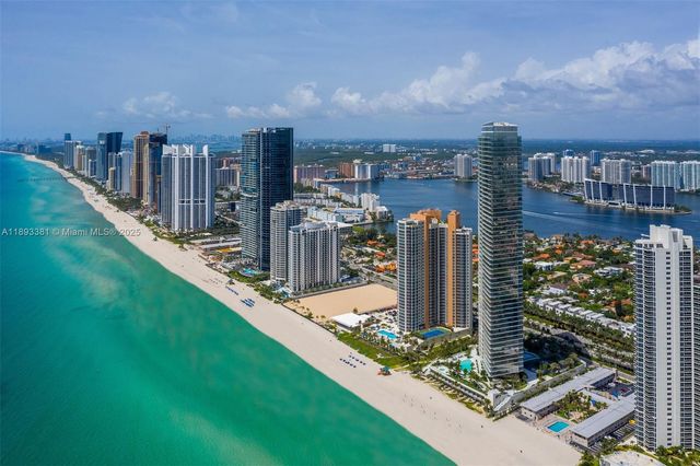 a view of a building with garden and sitting area