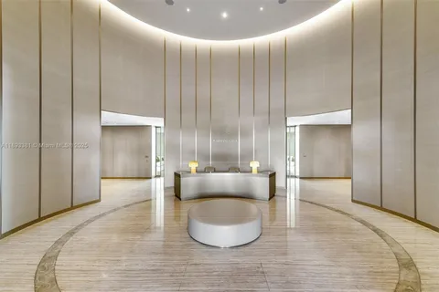 a dining room with a table and chairs