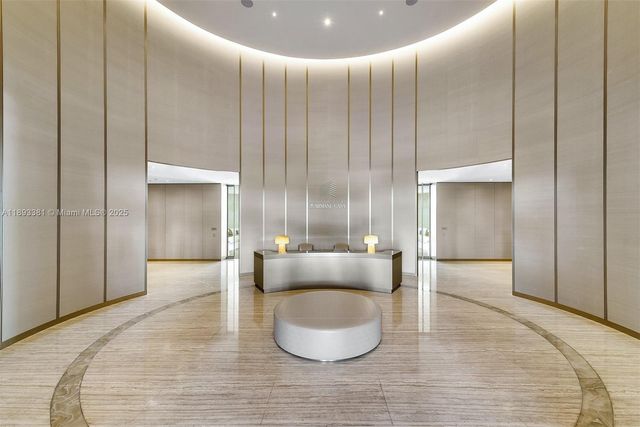 a dining room with a table and chairs