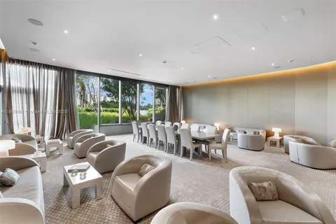 a living room with furniture and large window