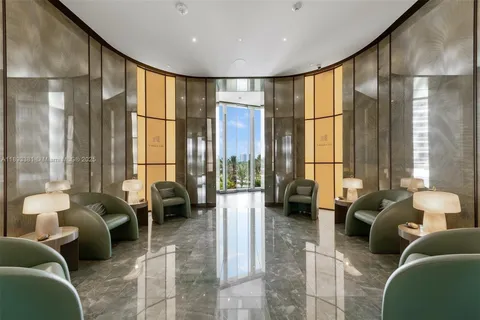 a room with lots of tables a large window and chairs