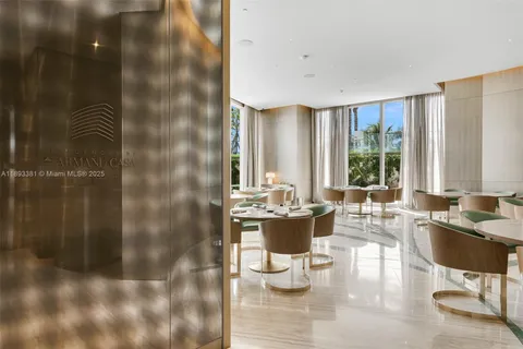 a kitchen with a white table and chairs