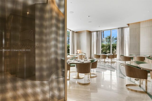 a kitchen with a white table and chairs