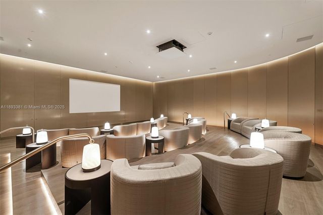 a kitchen with stainless steel appliances granite countertop a sink and a refrigerator