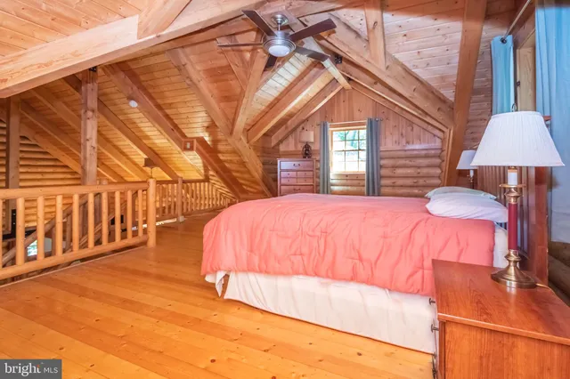 a view of a house with a wooden fence