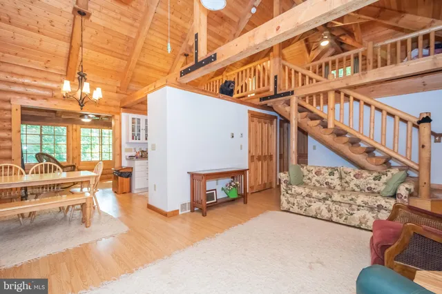 a bedroom with furniture and wooden floor