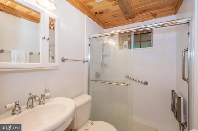 a bedroom with furniture and a large window