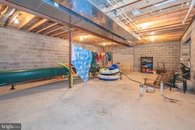 a view of a balcony with floor to ceiling windows with wooden fence