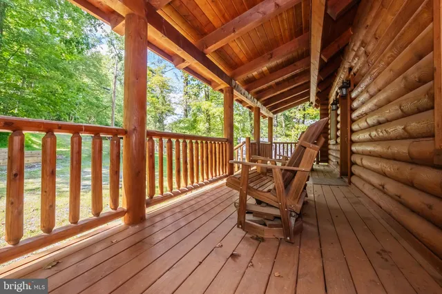 a view of house with backyard and outdoor seating