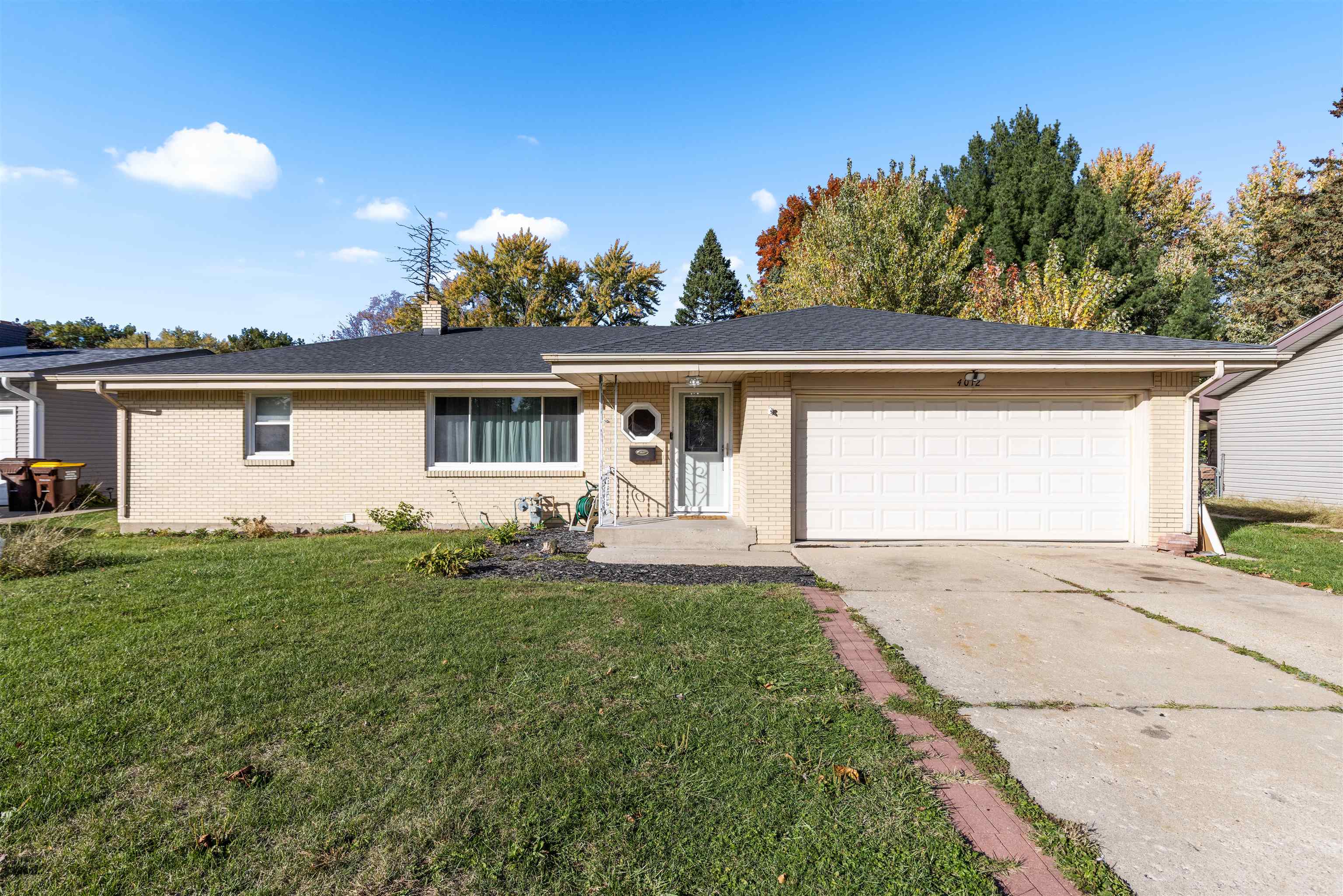 4012 Highcrest Road Rockford, IL 61107 - Photo 1 of 30 a front view of a house with garden