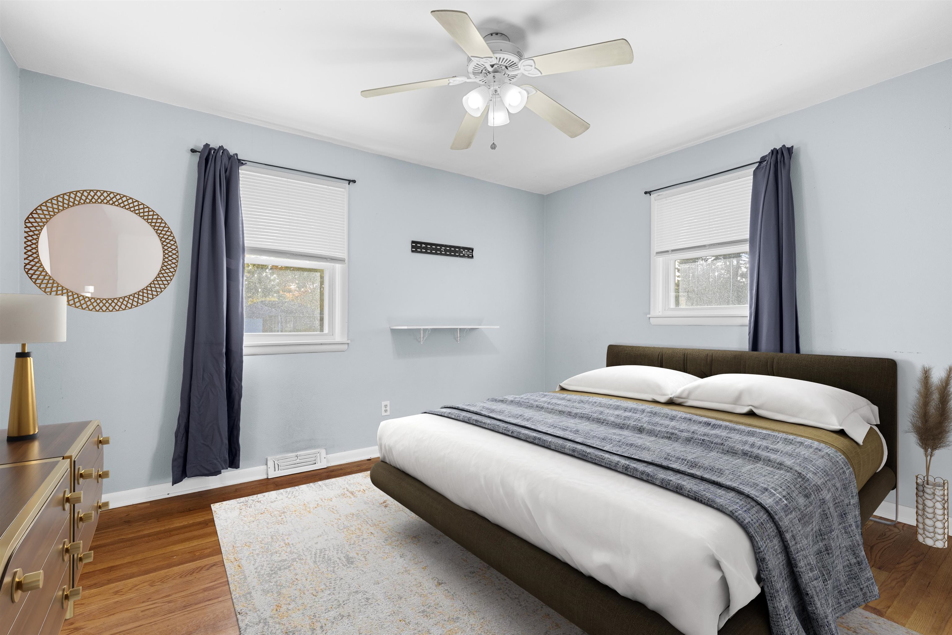 4012 Highcrest Road Rockford, IL 61107 - Photo 11 of 30 a bedroom with a large bed and a chandelier