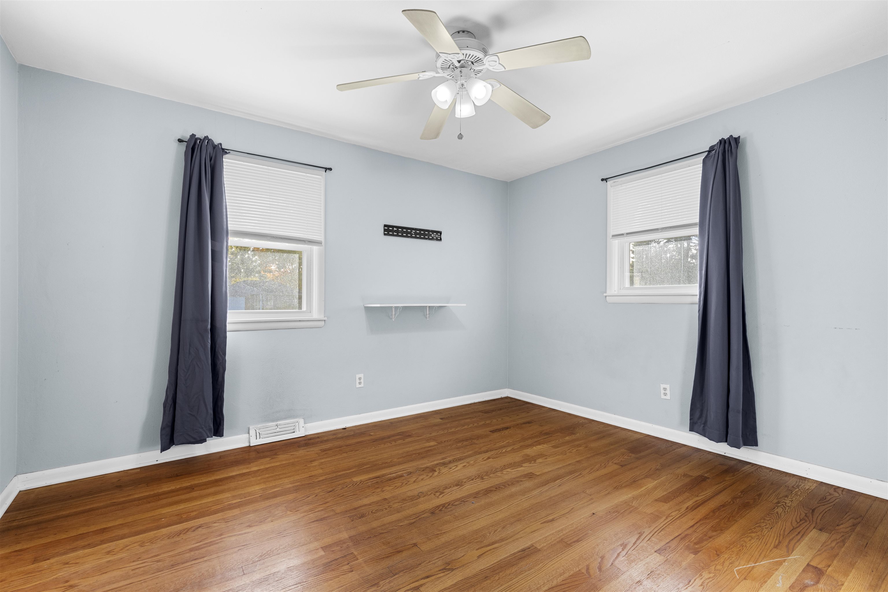 4012 Highcrest Road Rockford, IL 61107 - Photo 12 of 30 a view of a big room with wooden floor and windows
