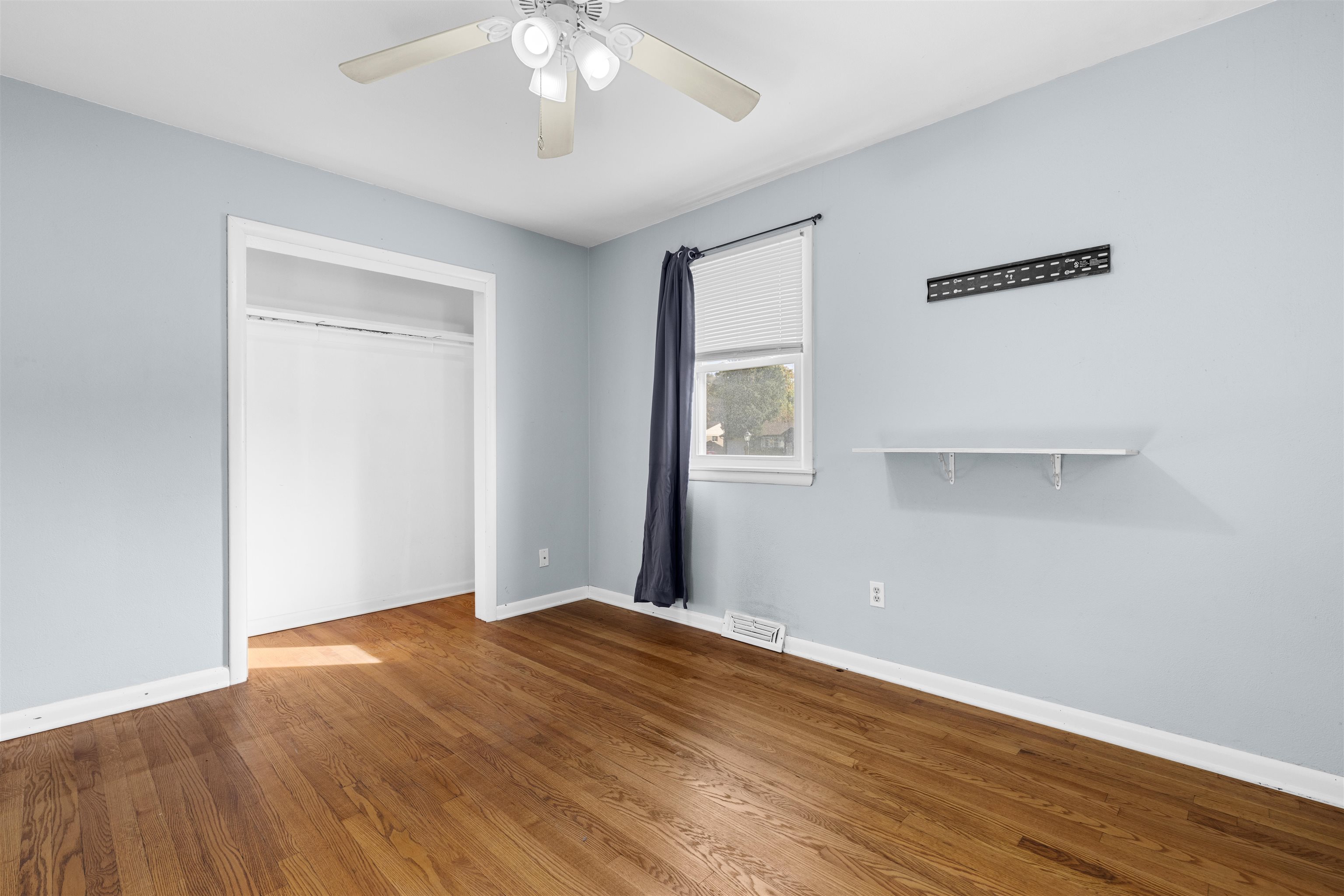 4012 Highcrest Road Rockford, IL 61107 - Photo 13 of 30 a view of an empty room with wooden floor and a window
