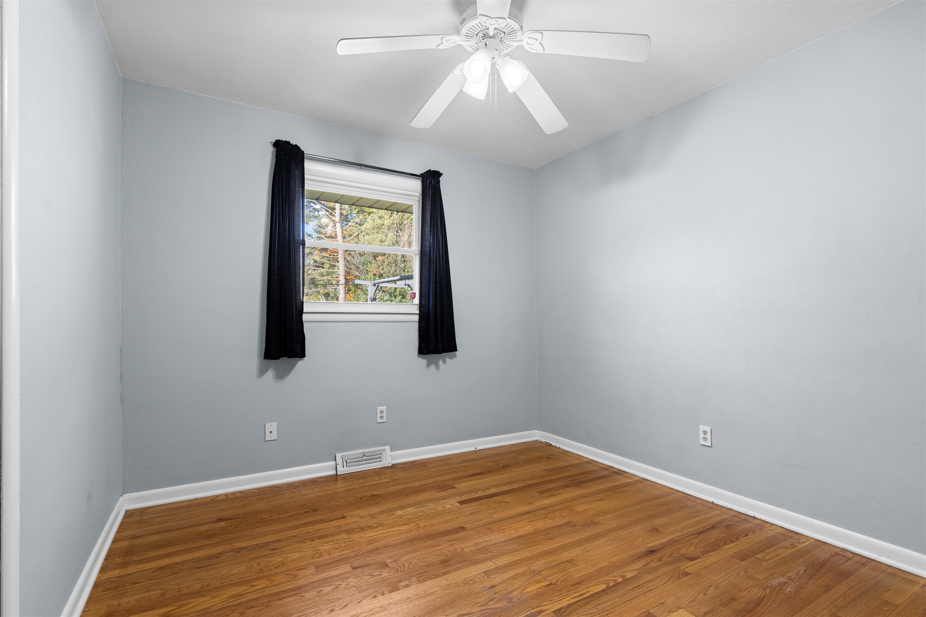 4012 Highcrest Road Rockford, IL 61107 - Photo 17 of 30 an empty room with wooden floor and windows
