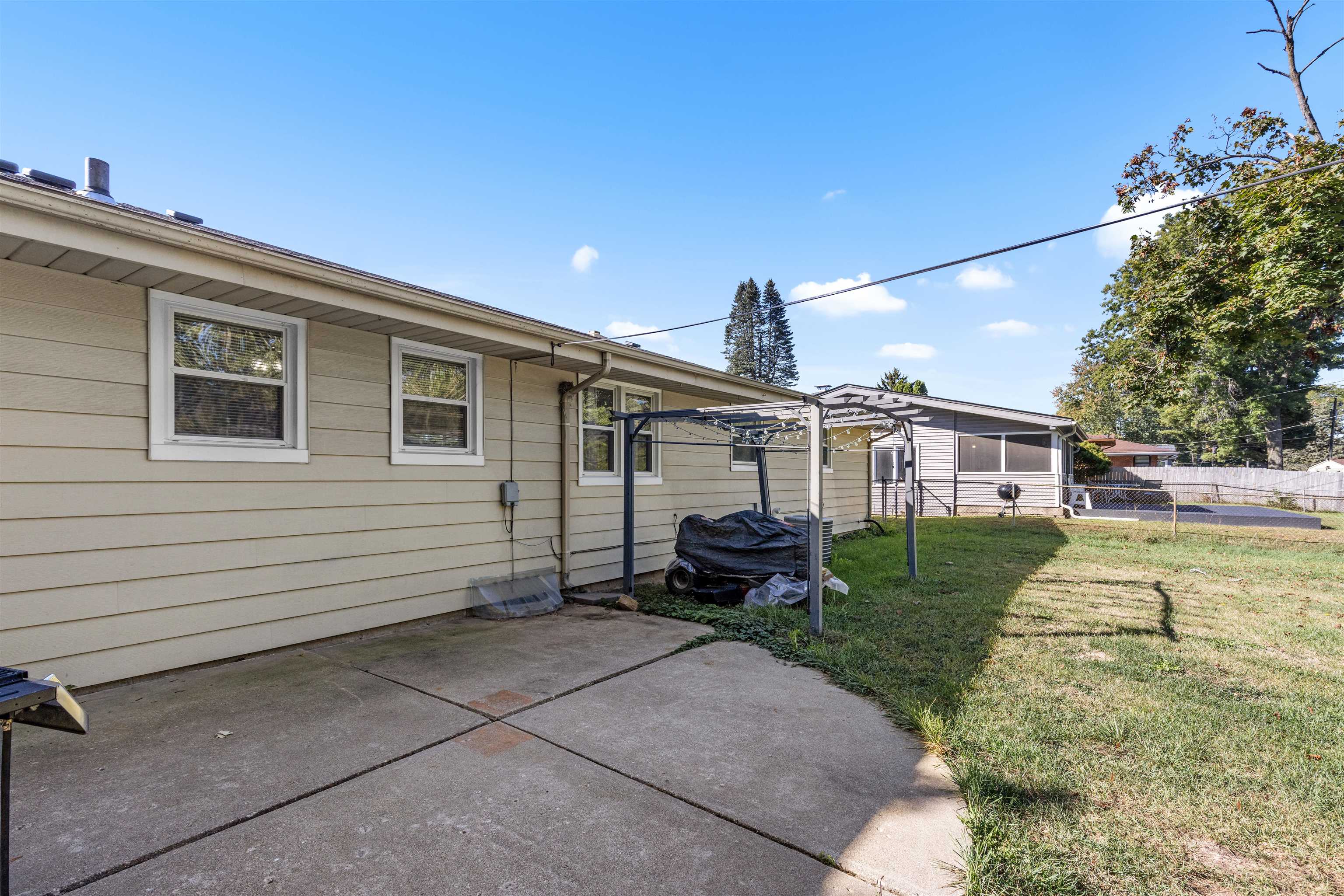 4012 Highcrest Road Rockford, IL 61107 - Photo 28 of 30 a view of a house with a yard and sitting area