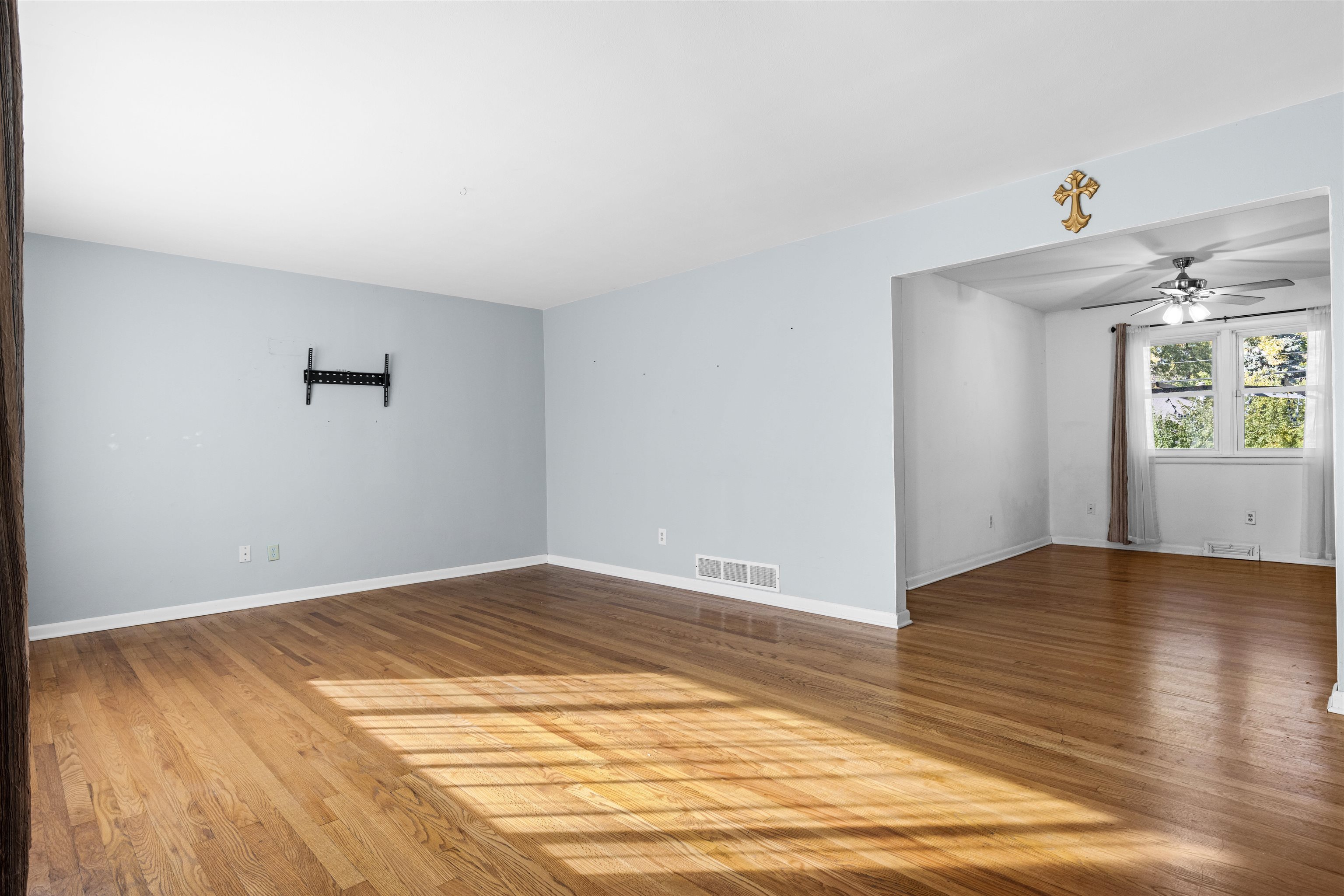 4012 Highcrest Road Rockford, IL 61107 - Photo 5 of 30 a view of an empty room with wooden floor and a window