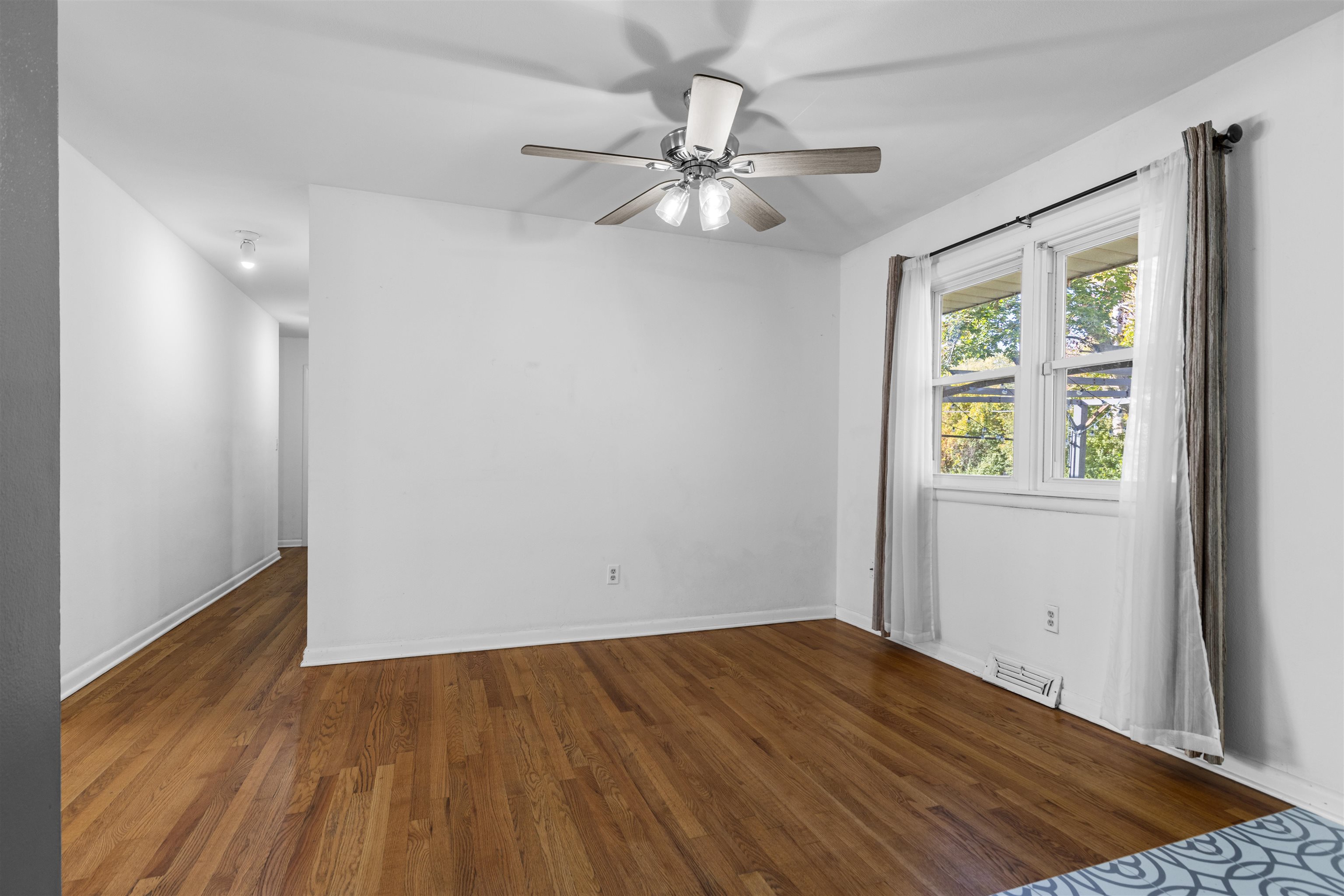 4012 Highcrest Road Rockford, IL 61107 - Photo 10 of 30 wooden floor in an empty room with a window