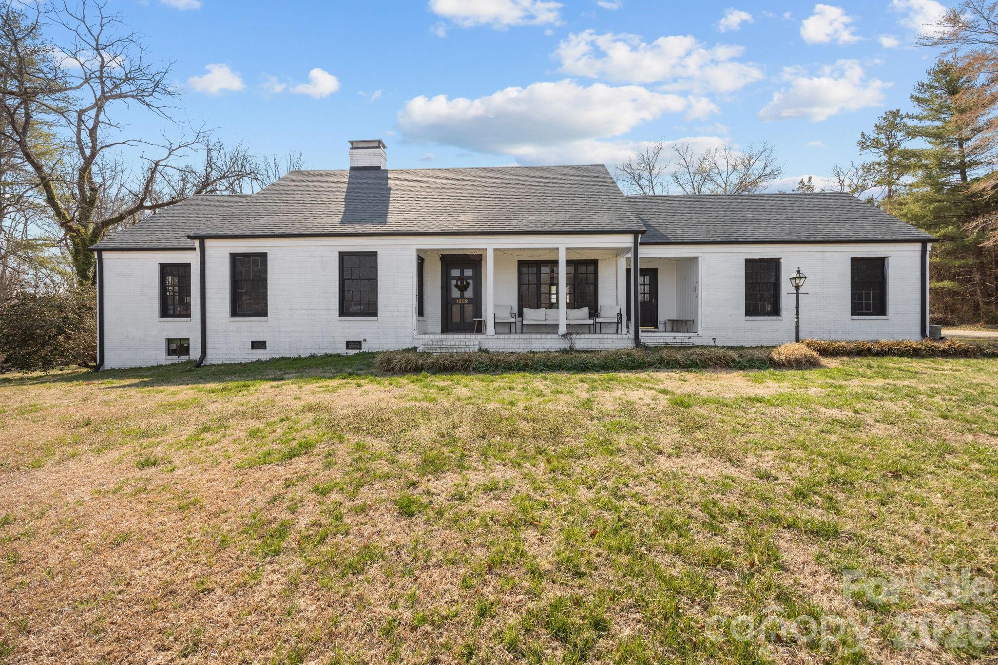 1352 City Lake Road Lexington, NC 27295 - Photo 1 of 36 a house view with a garden space