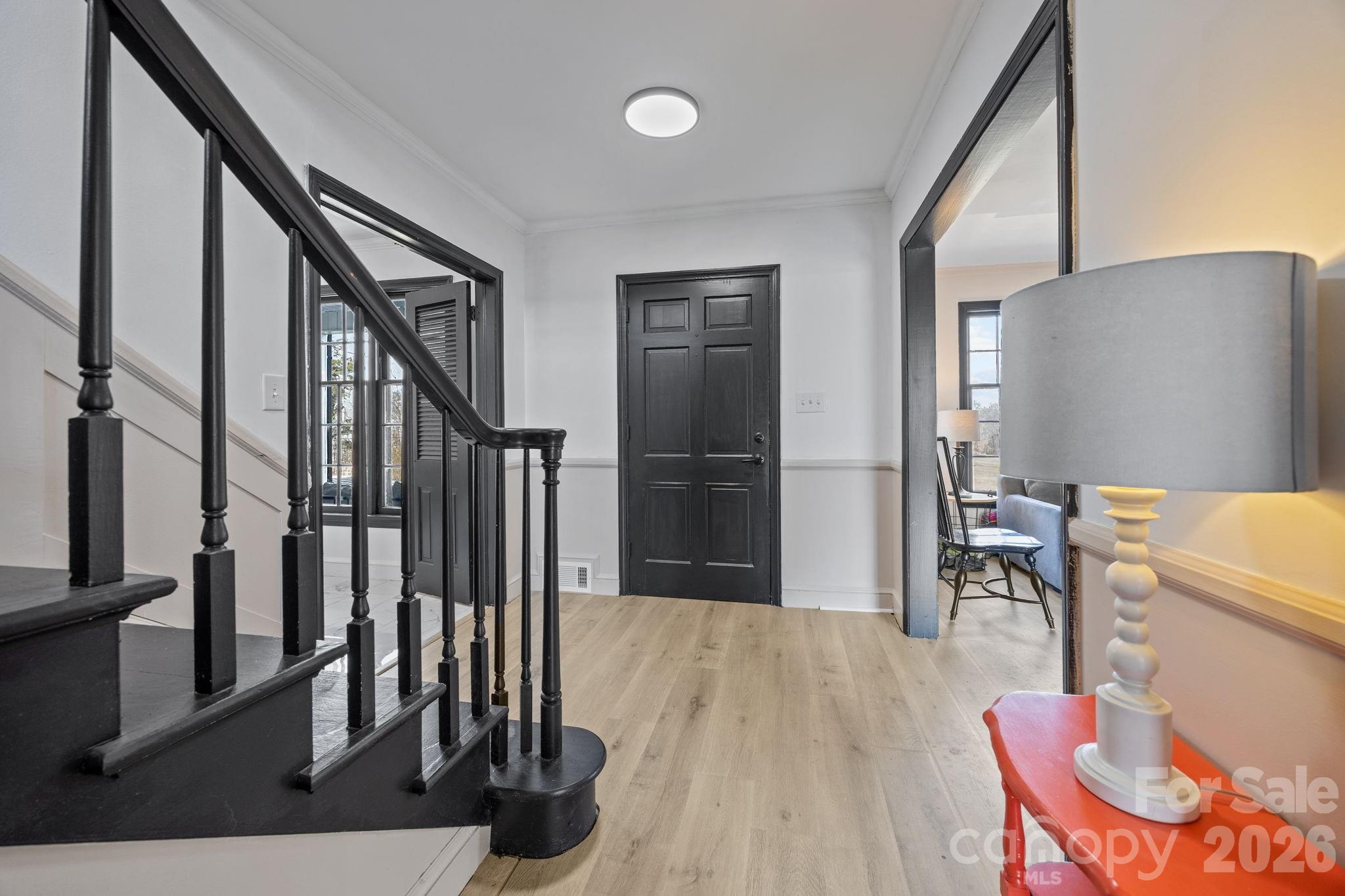 1352 City Lake Road Lexington, NC 27295 - Photo 18 of 36 a view of a hallway with wooden floor and staircase