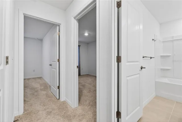 a bedroom with a bed and a potted plant