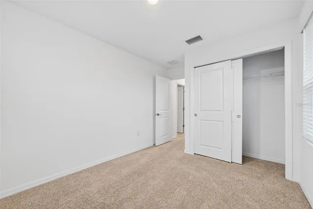 a view of a room with a hallway