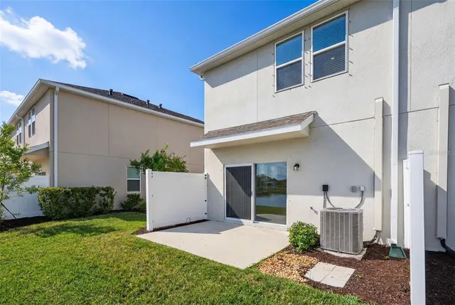 a view of a lake with houses in the back