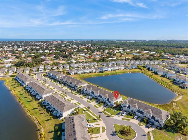 an aerial view of residential houses with outdoor space