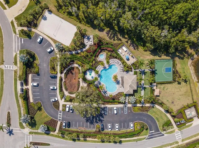 a view of a swimming pool with outdoor seating