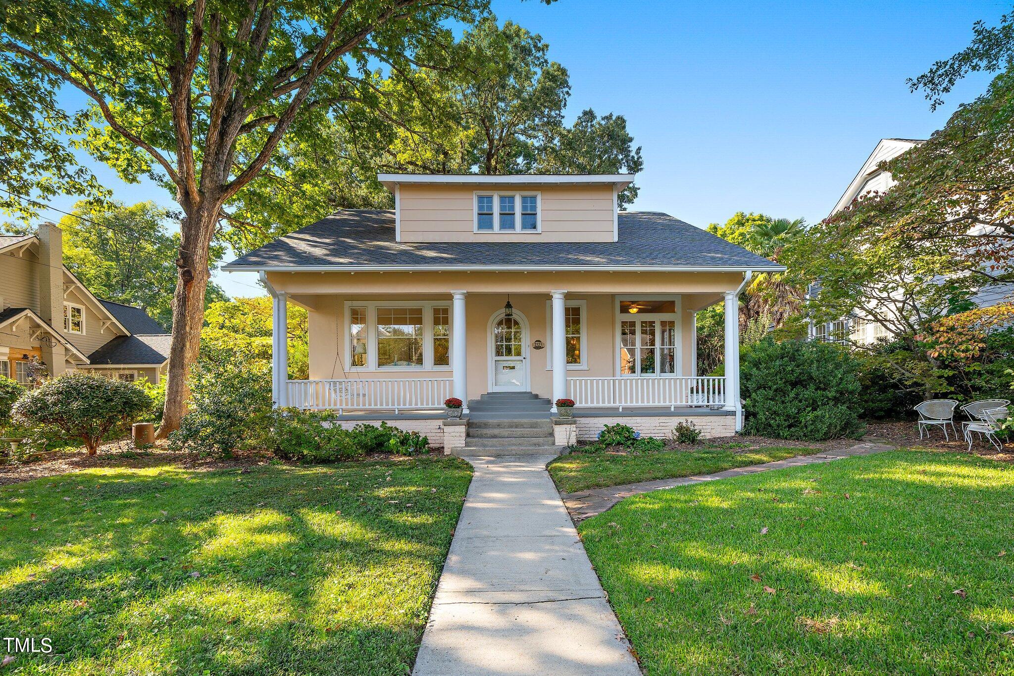 2121 Cowper Drive Raleigh, NC 27608 - Photo 1 of 38 a front view of house with yard and green space