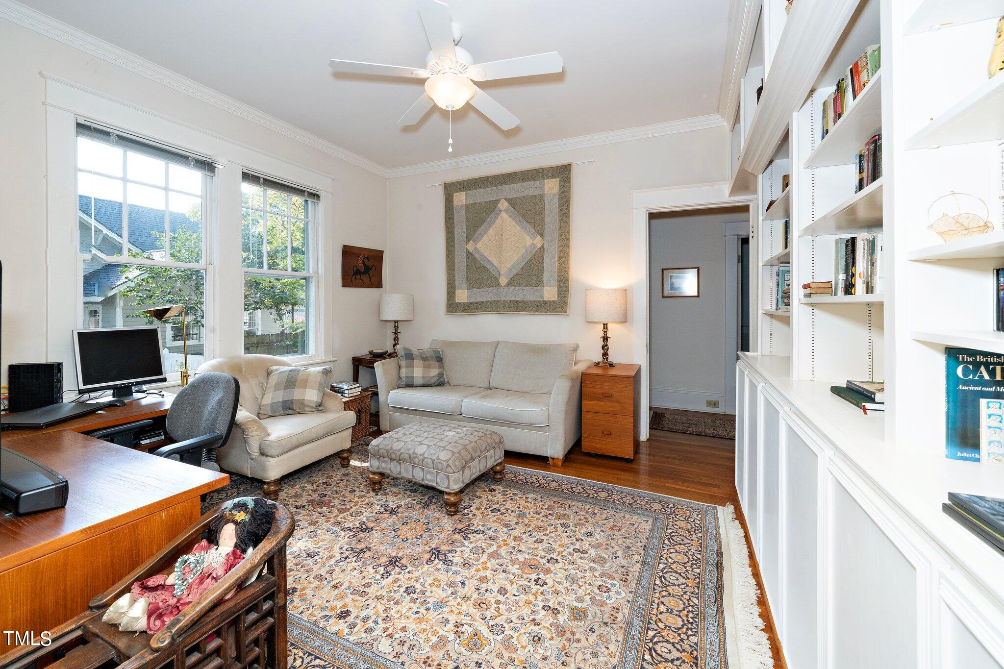 2121 Cowper Drive Raleigh, NC 27608 - Photo 12 of 38 a living room with furniture and a window
