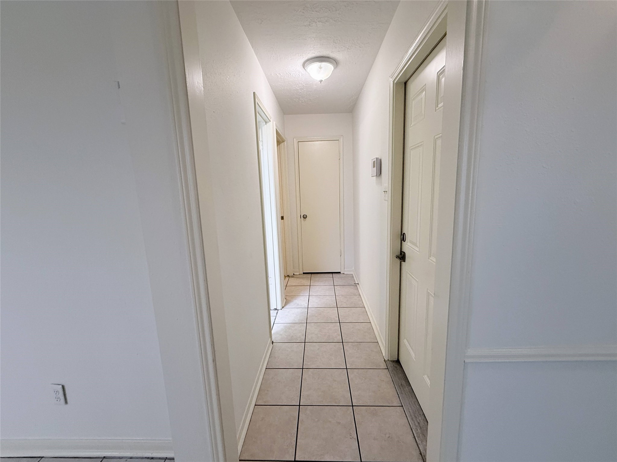 6902 Sandy Knolls Drive Spring, TX 77379 - Photo 5 of 30 hallway to the garage