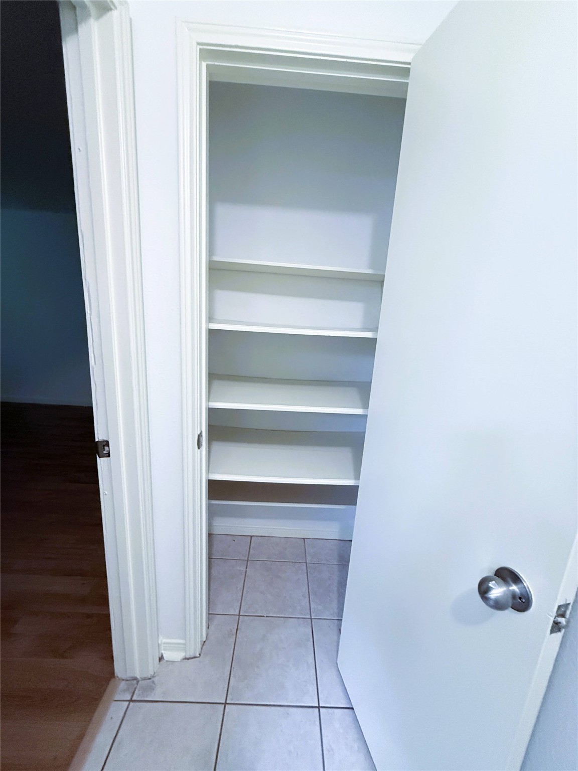 6902 Sandy Knolls Drive Spring, TX 77379 - Photo 9 of 30 linen closet to downstairs bath