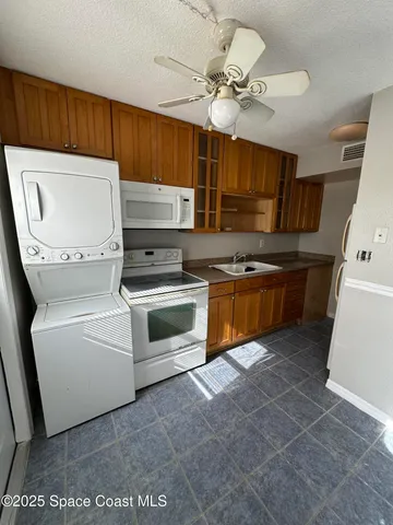 a kitchen with cabinets and appliances