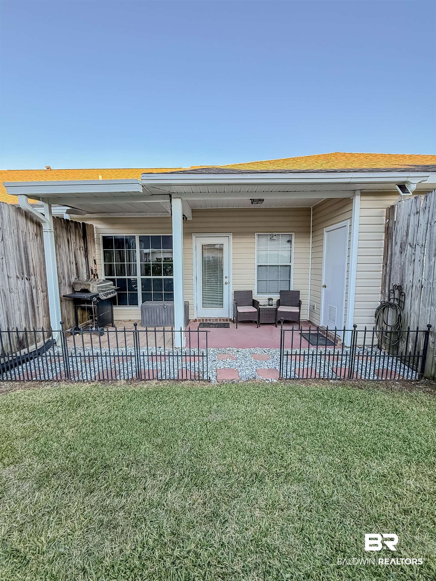 2651 South Juniper Street Foley, AL 36535 - Photo 17 of 20 Rear view of property with a fenced backyard and a patio