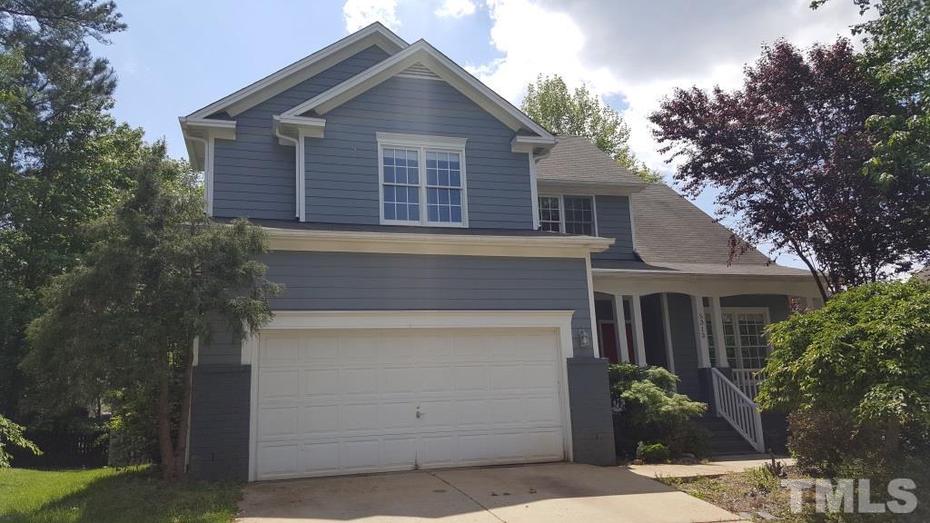 5313 Denmead Way Raleigh, NC 27613 - Photo 1 of 18 a front view of a house with a garden