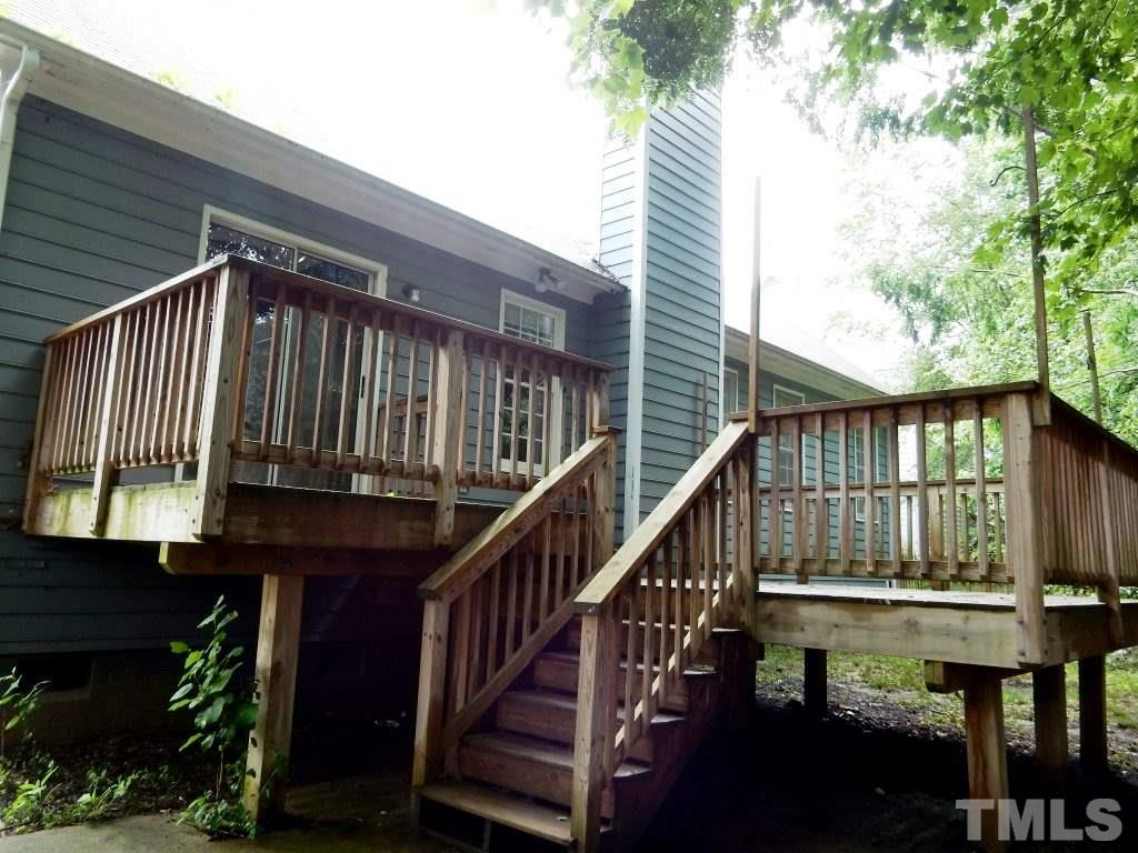 5313 Denmead Way Raleigh, NC 27613 - Photo 13 of 18 a view of a house with a wooden deck