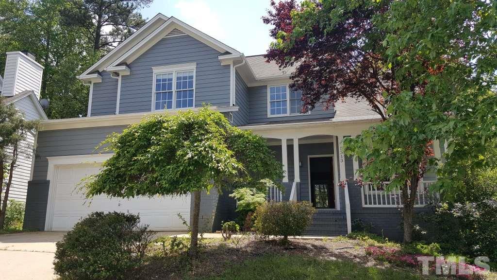 5313 Denmead Way Raleigh, NC 27613 - Photo 16 of 18 a front view of a house with garden