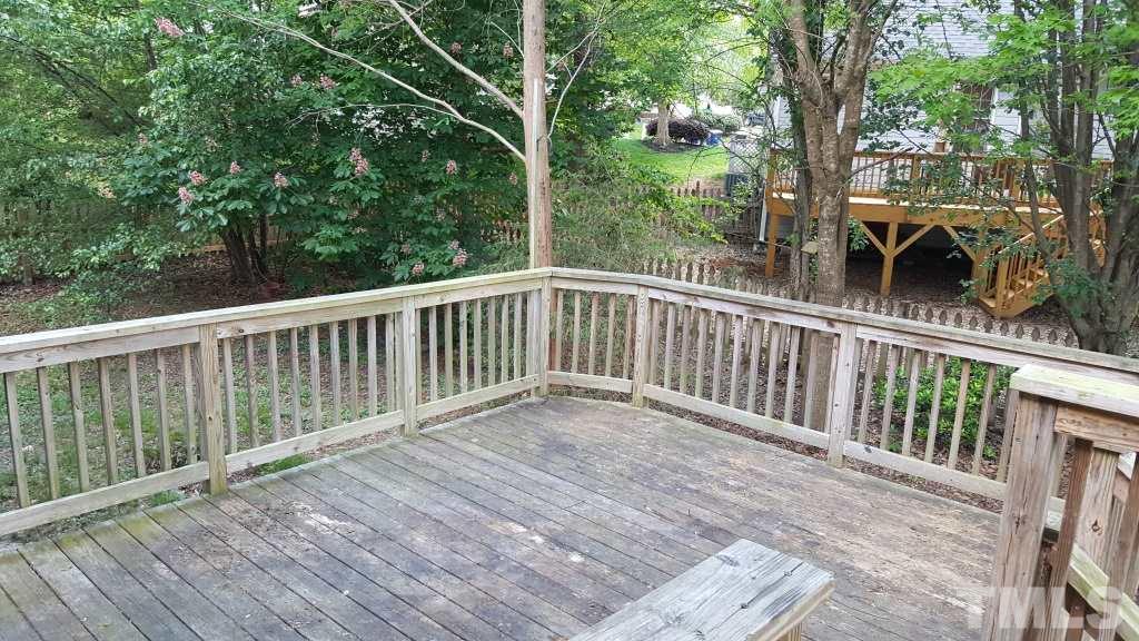 5313 Denmead Way Raleigh, NC 27613 - Photo 17 of 18 a view of backyard with deck and outdoor seating